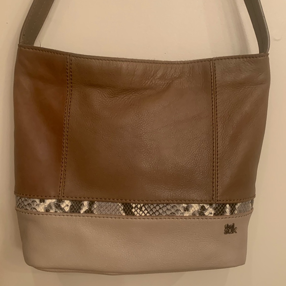 The Sak shades of tan with snake print trim genuine leather shoulder bag